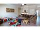 Bright and airy living room featuring a comfortable sectional sofa, stylish rug, and contemporary artwork at 261 Webster Lake Dr, Temple, GA 30179