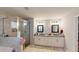 A primary bathroom with a glass shower, double vanity sinks, and modern fixtures at 261 Webster Lake Dr, Temple, GA 30179
