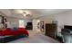 A primary bedroom with warm color bedding, modern furniture, and an ensuite bathroom at 261 Webster Lake Dr, Temple, GA 30179