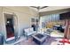 Cozy covered patio with outdoor seating, ceiling fan, and a view of the backyard at 261 Webster Lake Dr, Temple, GA 30179