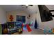 Bright playroom featuring a red slide, ball pit, and wall-mounted television at 261 Webster Lake Dr, Temple, GA 30179