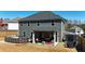 View of the backyard featuring an above ground pool and covered patio with outdoor furniture at 261 Webster Lake Dr, Temple, GA 30179