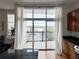 View from the kitchen to the balcony, showing the urban landscape and bringing natural light inside at 2630 Talley St # 426, Decatur, GA 30030