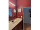 This powder room features an elongated vanity and a unique light fixture at 2630 Talley St # 426, Decatur, GA 30030