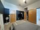 This bedroom offers ample closet space, dark walls and a gray bed at 2630 Talley St # 426, Decatur, GA 30030