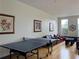 Another view of the community clubhouse with lounge seating and a ping pong table at 2630 Talley St # 426, Decatur, GA 30030