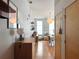 Hallway featuring hardwood floors, wall art, and leading to a living room area with natural light at 2630 Talley St # 426, Decatur, GA 30030