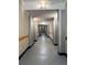 Hallway with neutral wall color and industrial design with overhead lighting throughout at 2630 Talley St # 426, Decatur, GA 30030