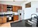 Modern kitchen with stainless steel appliances, granite countertops, and wooden cabinetry at 2630 Talley St # 426, Decatur, GA 30030