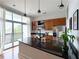Modern kitchen with a granite island, stainless appliances, and balcony access with natural lighting at 2630 Talley St # 426, Decatur, GA 30030