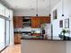 Contemporary kitchen with dark granite counters, wooden cabinets, and natural light from the balcony at 2630 Talley St # 426, Decatur, GA 30030