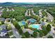 Community amenities include a sparkling pool and tennis courts, surrounded by mature trees and manicured grounds at 1020 Constitution Way, Cumming, GA 30040