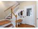 A beautiful entryway showcases hardwood floors, a staircase, and white trim at 1020 Constitution Way, Cumming, GA 30040