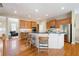 Open kitchen featuring stainless appliances, granite countertops, and seating at the counter at 1020 Constitution Way, Cumming, GA 30040