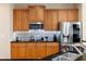 Modern kitchen with stainless steel appliances, granite countertops and stylish backsplash at 1020 Constitution Way, Cumming, GA 30040