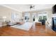 Bright living room with hardwood floors, neutral walls, and a fireplace, creating a warm and inviting space at 1020 Constitution Way, Cumming, GA 30040