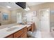 Large bathroom with dual sinks, granite countertops, and a large mirror at 1020 Constitution Way, Cumming, GA 30040