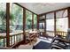 Relaxing screened porch with comfortable seating and views of the lush backyard at 1020 Constitution Way, Cumming, GA 30040