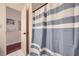 Bathroom featuring blue and white striped shower curtain at 1496 Leafmore Pl, Decatur, GA 30033
