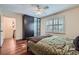 Bright bedroom with hardwood floors, closets, large windows, and modern ceiling fan at 1496 Leafmore Pl, Decatur, GA 30033