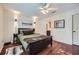 Comfortable bedroom with hardwood floors, ceiling fan and decorative wall art at 1496 Leafmore Pl, Decatur, GA 30033