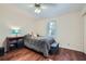 Bedroom with hardwood floors, soft carpet, and large window at 1496 Leafmore Pl, Decatur, GA 30033