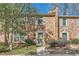 Charming brick townhome with manicured landscaping and inviting front entrance at 1496 Leafmore Pl, Decatur, GA 30033