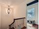 Elegant staircase with wrought iron railing and hardwood flooring at 1496 Leafmore Pl, Decatur, GA 30033