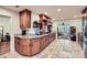 Spacious kitchen boasts custom cabinetry, granite countertops, and travertine floors at 1496 Leafmore Pl, Decatur, GA 30033