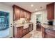 Well-equipped kitchen with custom cabinets, granite counters, and a farmhouse sink at 1496 Leafmore Pl, Decatur, GA 30033