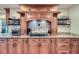 Close-up of the kitchen featuring stainless steel appliances, a gas cooktop, and custom cabinetry at 1496 Leafmore Pl, Decatur, GA 30033