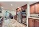 Modern kitchen with stainless steel appliances offering views into the adjacent living room at 1496 Leafmore Pl, Decatur, GA 30033