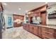 Spacious kitchen with custom cabinets, granite countertops, stainless steel appliances, and tile floors at 1496 Leafmore Pl, Decatur, GA 30033