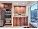 Convenient laundry area integrated into the kitchen, featuring modern appliances and storage at 1496 Leafmore Pl, Decatur, GA 30033