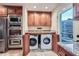 Laundry area features a full washer and dryer along with modern appliances at 1496 Leafmore Pl, Decatur, GA 30033