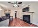 Spacious living room featuring hardwood floors, a fireplace, and built-in shelving at 1496 Leafmore Pl, Decatur, GA 30033