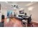 Cozy living room featuring hardwood floors, a comfortable sofa, and a dedicated workspace at 1496 Leafmore Pl, Decatur, GA 30033