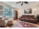 Comfortable living room with hardwood floors, and natural light from large windows at 1496 Leafmore Pl, Decatur, GA 30033