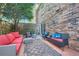 Outdoor patio with brick wall, comfortable seating and a garden view at 1496 Leafmore Pl, Decatur, GA 30033