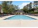 Large community swimming pool with lounge chairs and landscaped surroundings at 1496 Leafmore Pl, Decatur, GA 30033