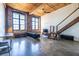 Open living room featuring exposed brick, large windows, and concrete floors at 170 Boulevard Se # 421 H, Atlanta, GA 30312