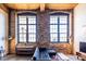 Living area featuring exposed brick, large windows, and polished concrete floors at 170 Boulevard Se # 421 H, Atlanta, GA 30312