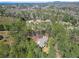 An aerial view of a beautiful house surrounded by lush greenery and tall trees at 2051 E Piedmont Rd, Marietta, GA 30062