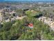 Aerial view of a wooded neighborhood showcasing a home with mature trees and green spaces at 2051 E Piedmont Rd, Marietta, GA 30062
