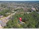 Aerial view of a single-Gathering home surrounded by mature trees and lush greenery at 2051 E Piedmont Rd, Marietta, GA 30062