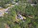 Aerial view of a home surrounded by mature trees and lush greenery at 2051 E Piedmont Rd, Marietta, GA 30062