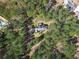Aerial view of a single-Gathering home surrounded by mature trees and lush greenery at 2051 E Piedmont Rd, Marietta, GA 30062