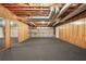 Large basement area with wood paneling, carpet flooring and exposed ductwork at 2051 E Piedmont Rd, Marietta, GA 30062