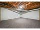 Unfinished basement featuring carpet flooring and exposed ceiling at 2051 E Piedmont Rd, Marietta, GA 30062