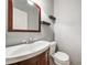 Stylish powder room with modern sink, wood accents, and floating shelves at 2051 E Piedmont Rd, Marietta, GA 30062